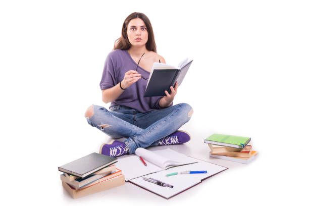 istock Young stressed student girl studying pile of books 844385564