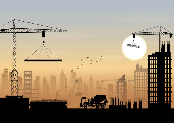 istock Silhouettes of cranes working on the building 844385944