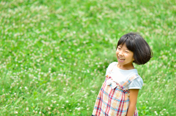 istock Girl playing in the grassland 844386260
