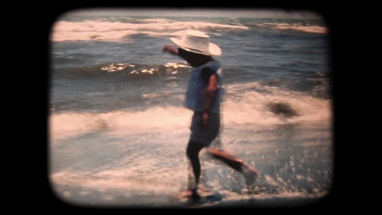 60's 8mm footage - Boy Splashing In the Sea