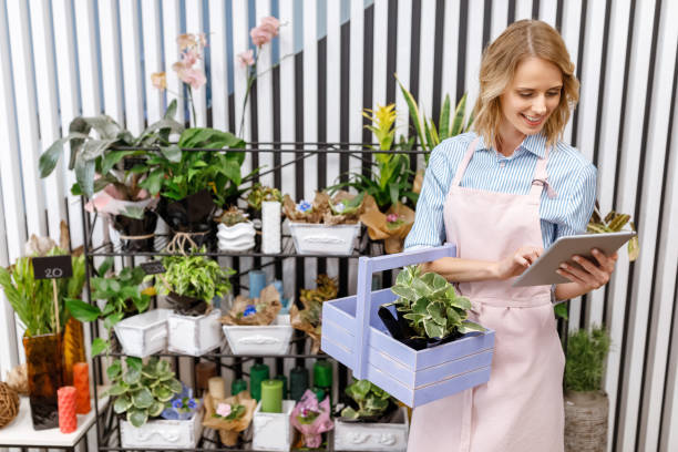 istock florist with digital tablet in flower shop 844389510