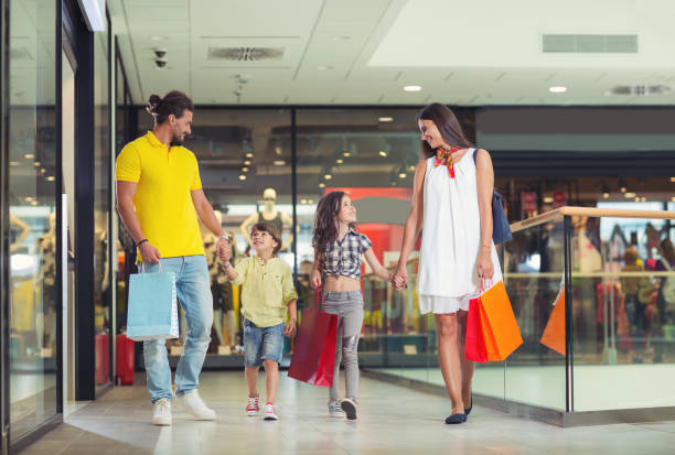 istock Smiling family shopping together 844389824