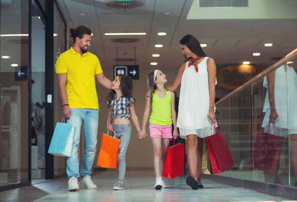 istock Smiling family shopping together 844390142