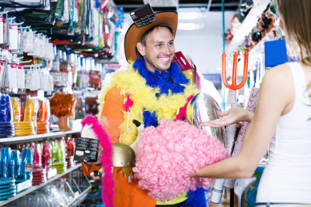 istock Smiling man with girlfriend trying on cowboy hat 844390684