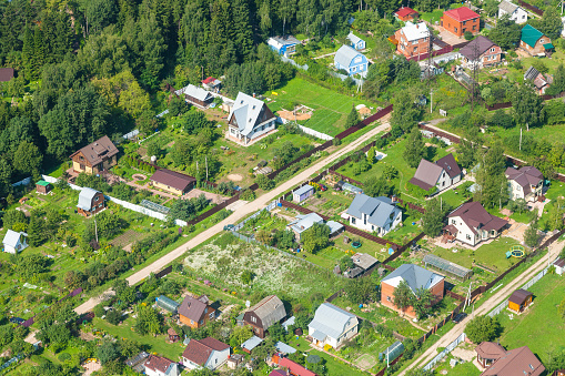 above view of cottages in suburb village in summer