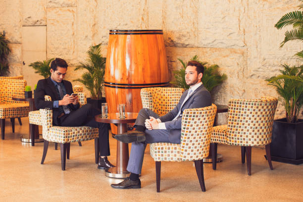 istock Two Middle-aged Business Men Relaxing in Cafe 844393580