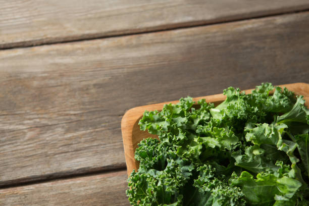 istock Close up overhead view of fresh kale in bowl 844394006