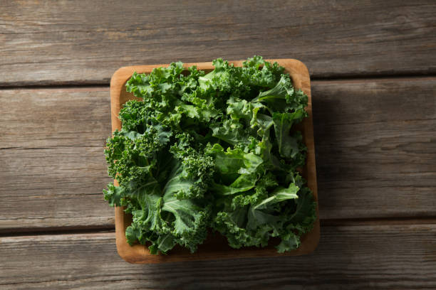 istock Overhead view of fresh kale on table 844394112