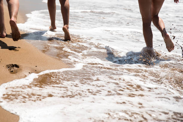 istock Women running in the ocean 844394534