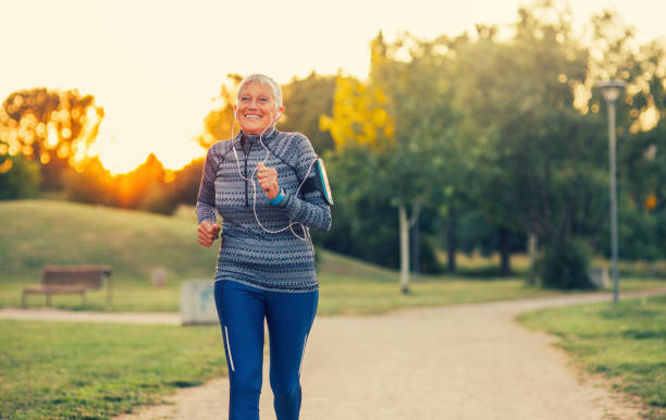 istock Senior woman jogging in the park 844394620