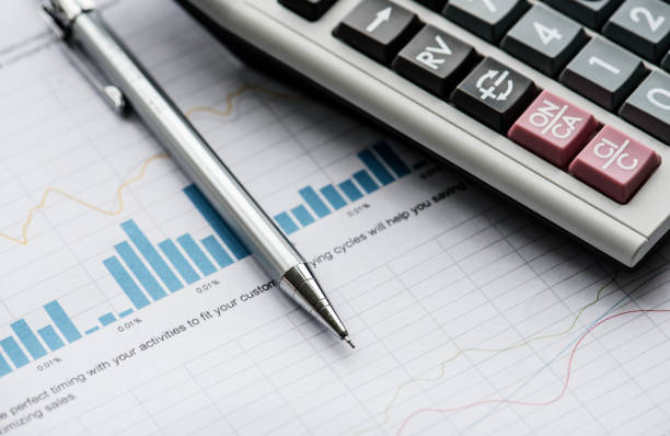 istock Closeup of pencil next to calculator 844398048