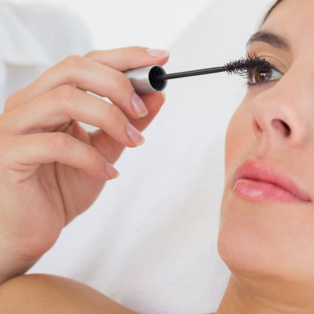 istock Hand applying mascara to beautiful woman 844400726