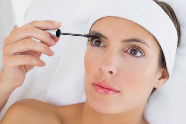 istock Hand applying mascara to beautiful woman 844400764