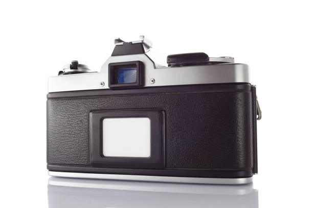 istock Old vintage film camera with lens isolated on white background 844402276