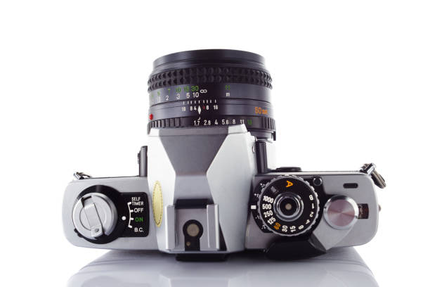 istock Old vintage film camera with lens isolated on white background 844402334