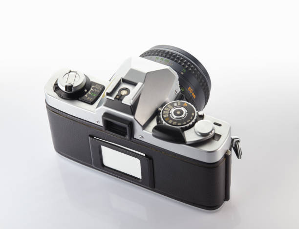 istock Old vintage film camera with lens isolated on white background 844402530