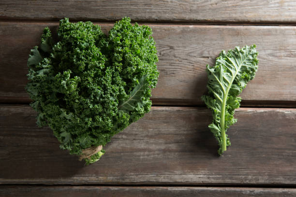 istock Kale vegetable on wooden table 844405664
