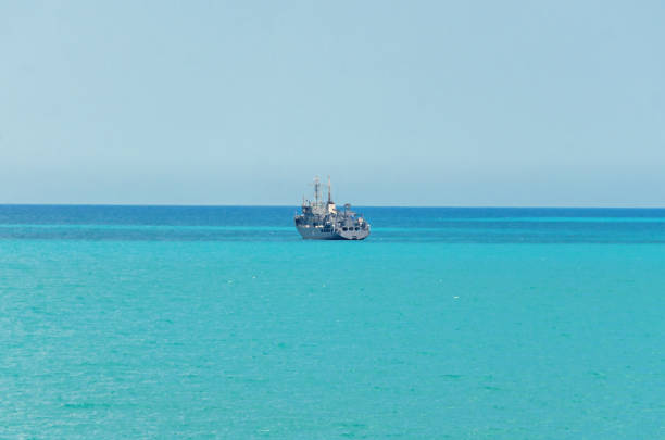 istock Boat or ship navigating on blue Black Sea water, cargoboat 844405978
