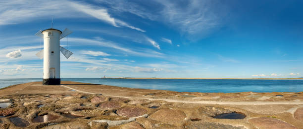 istock Windmill lighthouse iin Swinoujscie, Poland, panoramic image 844409412