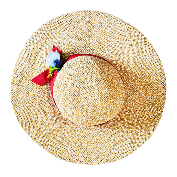 top view of wide brim straw hat with red band and textile flower isolated on white background