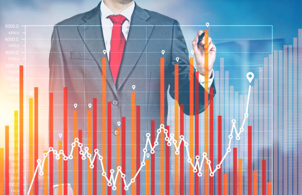 istock Businessman drawing a graph, city 844417146