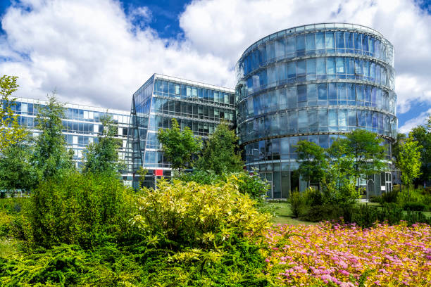 istock Green square in front of office buildings compex 844417600