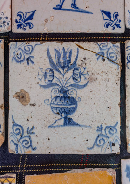istock Delfts blue 18th century tulip vase on cracked tile 844417744