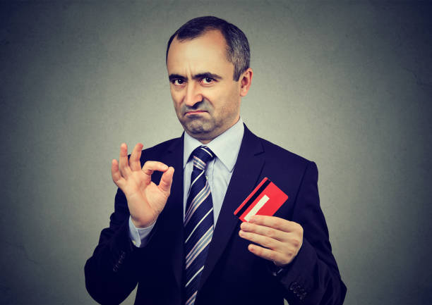 Sly liar businessman employee reassuring their credit card is the best Sly liar businessman employee reassuring their credit card is the best ponzi scheme stock pictures, royalty-free photos & images