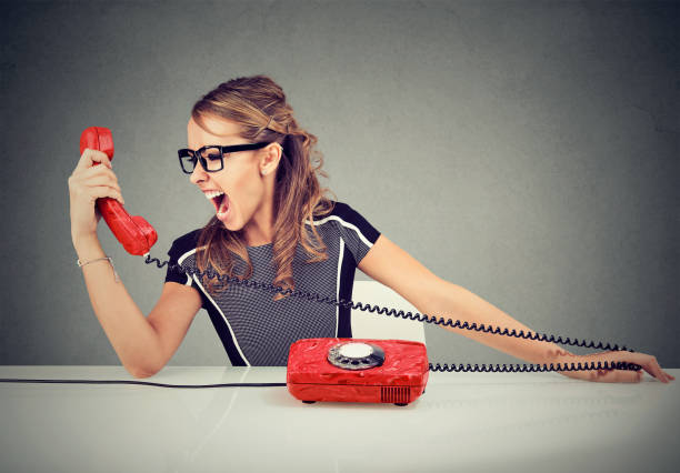 istock Young woman yelling on the phone 844423398