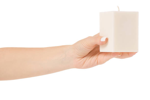 istock Female hand holding a white candle 844424390