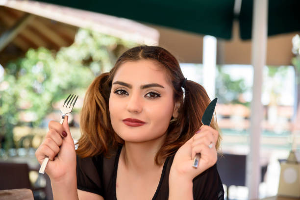 istock Women hand holding fork and knife 844424590