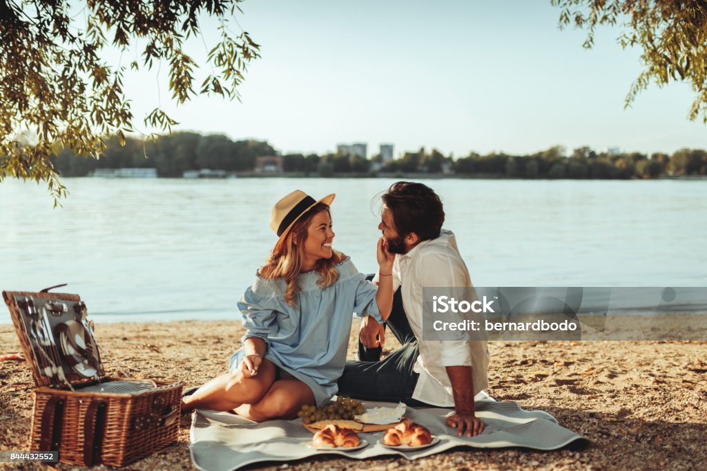 Our time together is always the best time Full length portrait of young couple having good times on a picnic date. Picnic Stock Photo