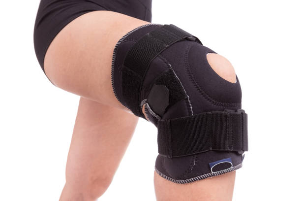 istock Orthopedic bandage on his knee. Sprain the leg muscles. 844432694