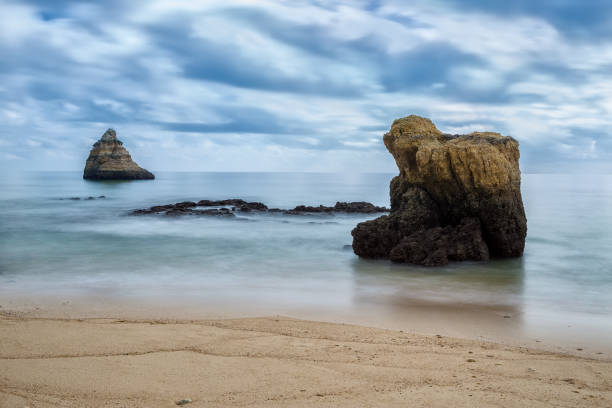 istock Dramatic seascape blurred waves. Portugal, Algarve. 844433000