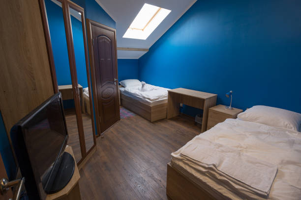 istock bedroom hotel, hotel, blue walls, skylights 844437378