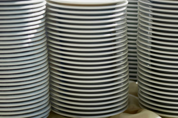 istock plates stacked on a table.Set of white dishes on table on light background 844440798