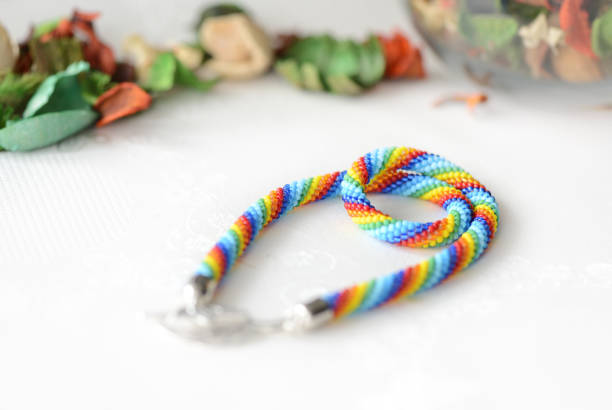 istock Rainbow beaded necklace on a textile background close up 844444398