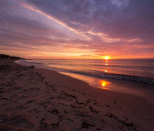 istock bright, fire sunset on the sea beach 844447056