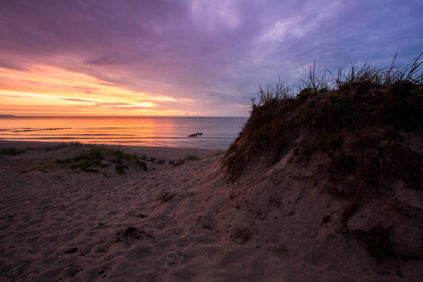 istock bright, fire sunset on the sea beach 844447064