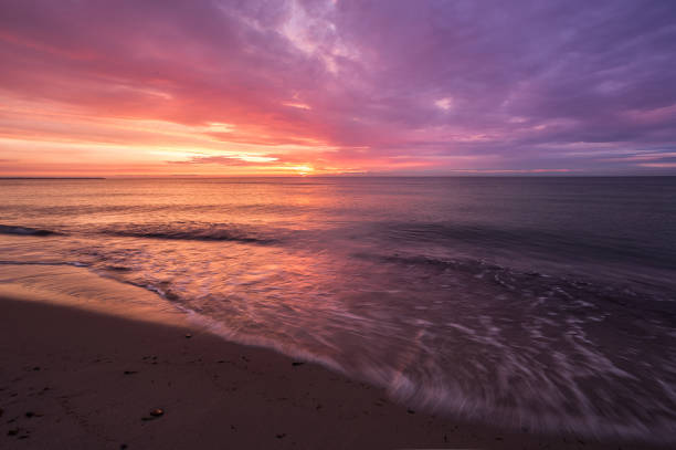 istock bright, fire sunset on the sea beach 844447074