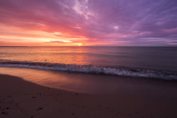 istock bright, fire sunset on the sea beach 844447078