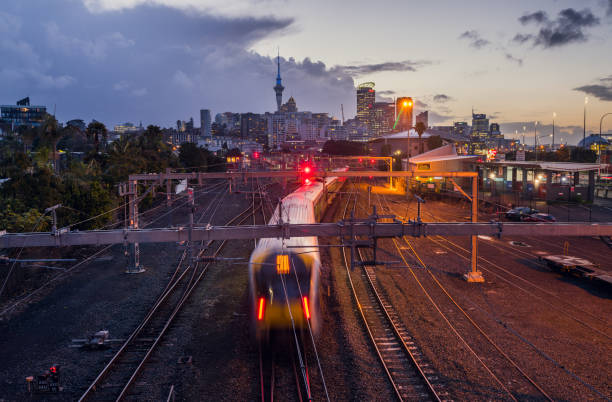 Auckland City Skyline. Railway crossing in Auckland with City in Background. auckland stock pictures, royalty-free photos & images
