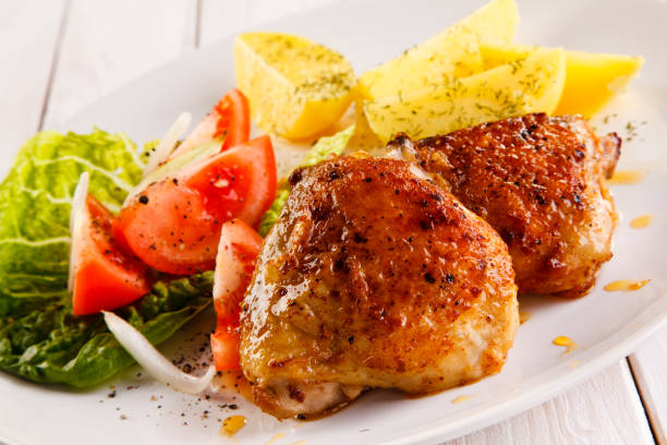 istock Roast chicken leg and vegetables 844455962