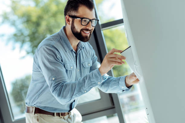 istock Pleasant office worker putting a folder to the cabinet shelf 844456166