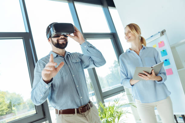 istock Young man trying out new VR headset in the office 844459154