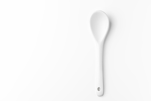 White spoon isolated on a white surface