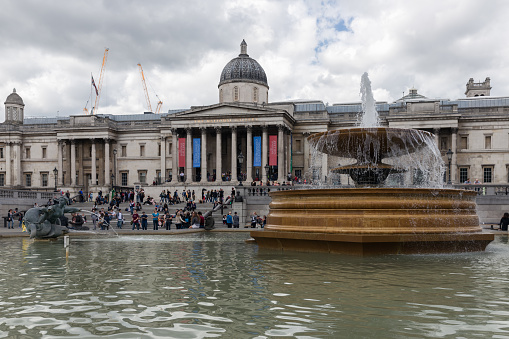 London, England - June 09, 2017: Trafalgar Square with tourists and view at the National Gallery in London