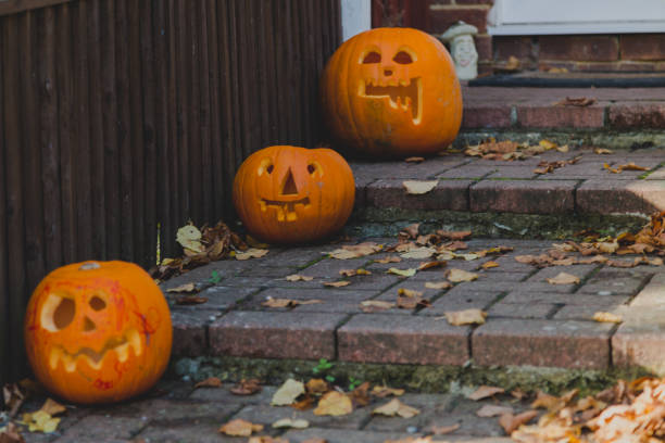 istock Doorway halloween decoration with scary funky pumpkins 844472032