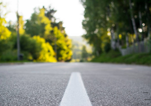 istock Mountain, asphalt road on sunset. Blured photo. 844477080