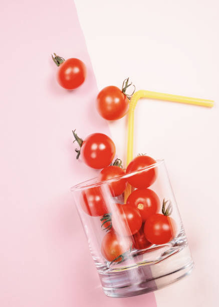istock Tomato juice or smoothie, cherry tomato in drink glass with straw 844477708